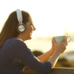 depositphotos_794721244-stock-photo-happy-woman-wearing-wireless-headphone