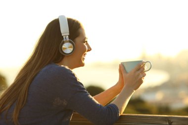 depositphotos_794721244-stock-photo-happy-woman-wearing-wireless-headphone
